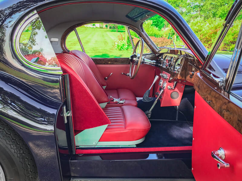 Jaguar XK120 Fixed Head Coupe with red interior